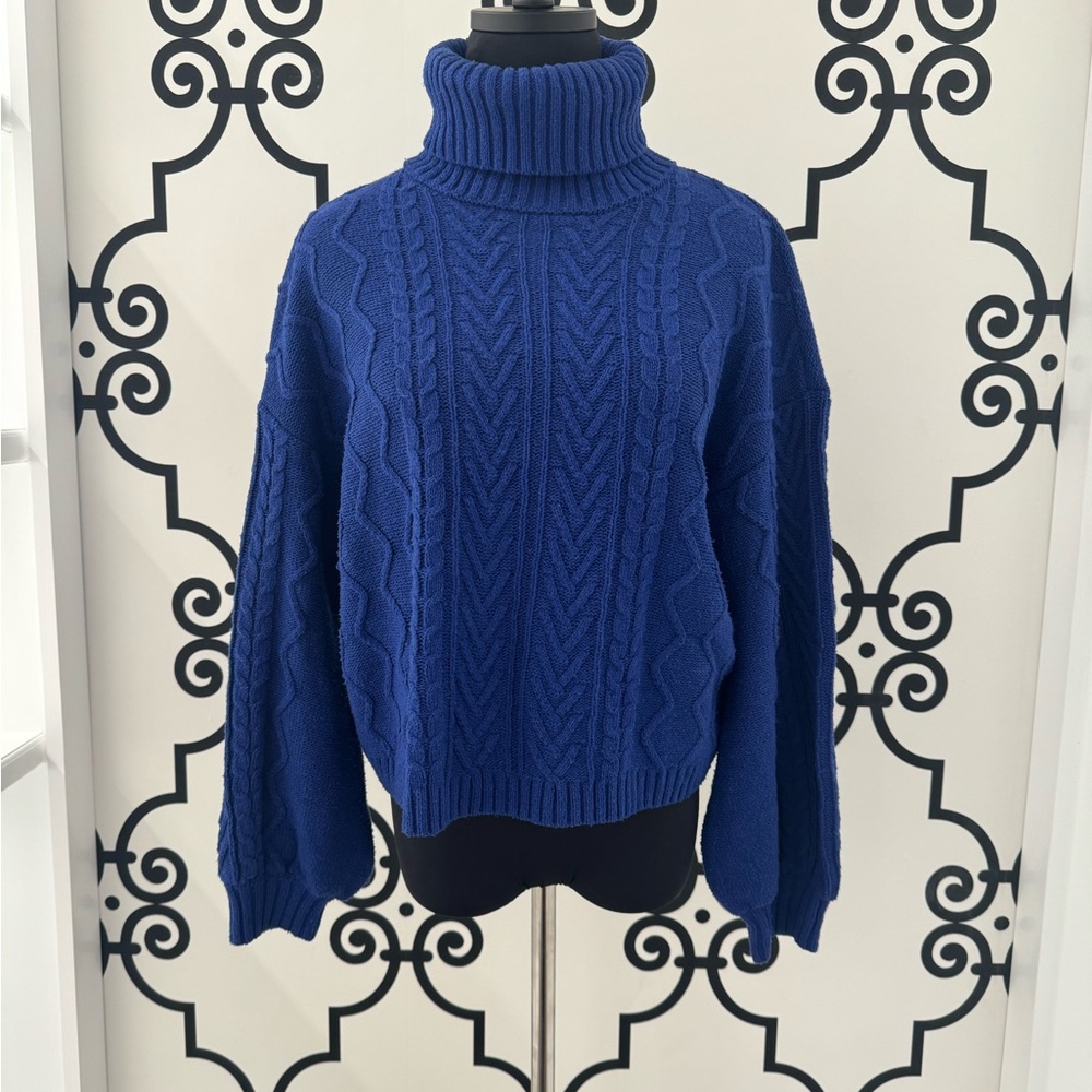 Navy blue turtleneck sweater.